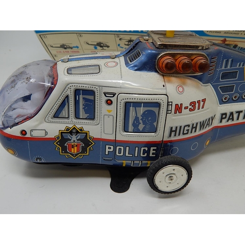 412 - 1960's Tin Plate Super Flying police Helicopter from the TV series Highway Patrol (boxed)