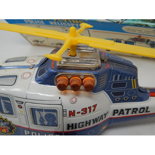 412 - 1960's Tin Plate Super Flying police Helicopter from the TV series Highway Patrol (boxed)