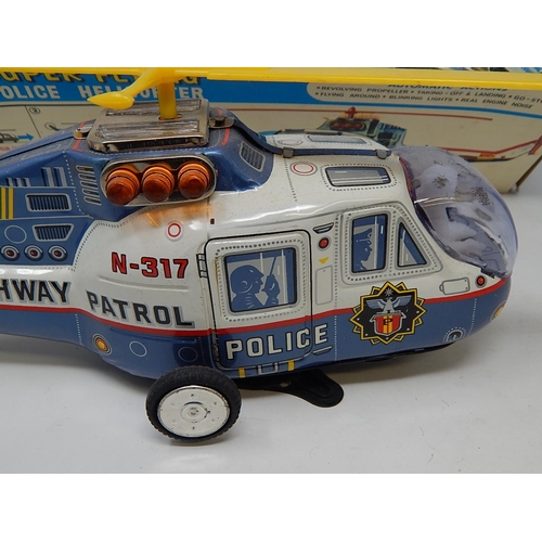 412 - 1960's Tin Plate Super Flying police Helicopter from the TV series Highway Patrol (boxed)