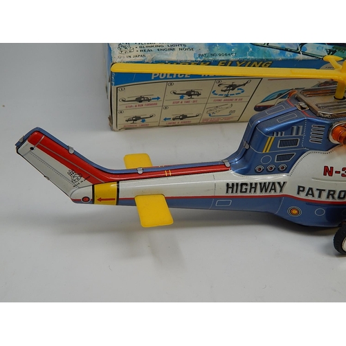 412 - 1960's Tin Plate Super Flying police Helicopter from the TV series Highway Patrol (boxed)