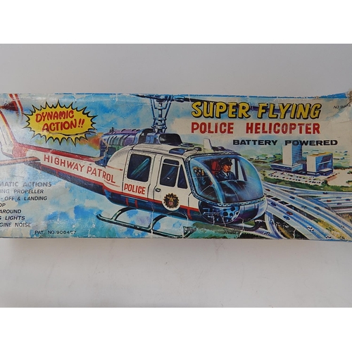 412 - 1960's Tin Plate Super Flying police Helicopter from the TV series Highway Patrol (boxed)