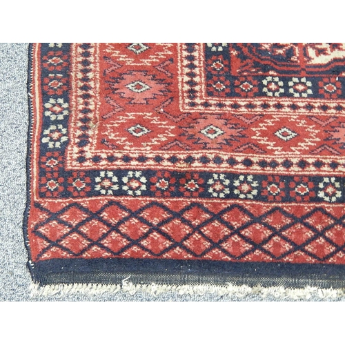 423 - Vintage Rug with Red Ground & Medallions: Size: 130cm x 95cm