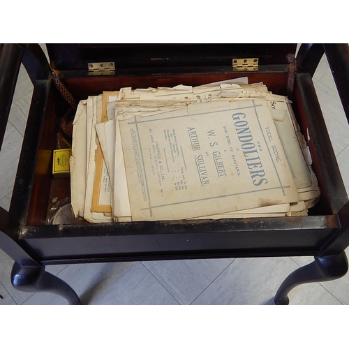 700 - WITHDRAWN: Early 20th century mahogany piano stool with lift up seat complete with sheet music. 58cm... 