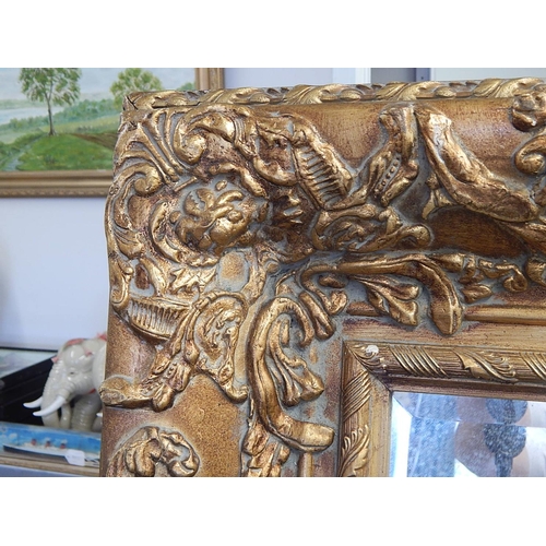 704 - WITHDRAWN: Large French Gilt Mirror with Bevelled Plate. The frame with shell & foliate decoration. ... 