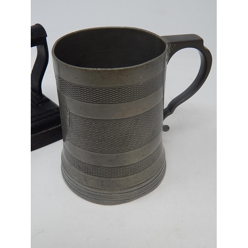 427 - 19th century glass bottomed pewter tankard with touch marks together with a cast flat Iron.