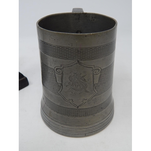 427 - 19th century glass bottomed pewter tankard with touch marks together with a cast flat Iron.