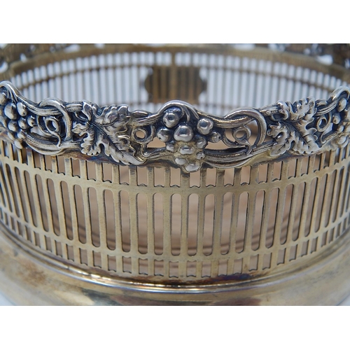 6 - Sterling Silver Bottle Coaster with cast & applied border of grapes & vines. 11.5cm diameter.