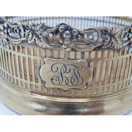 6 - Sterling Silver Bottle Coaster with cast & applied border of grapes & vines. 11.5cm diameter.