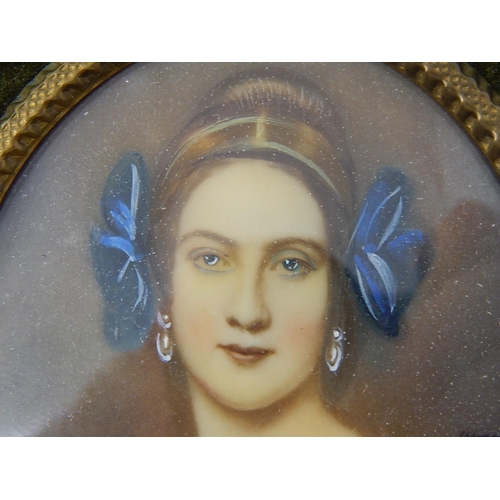 442 - 19th Century Portrait Miniature of a Lady, Signed, within an oval green velvet frame. 8cm x 6cm pict... 