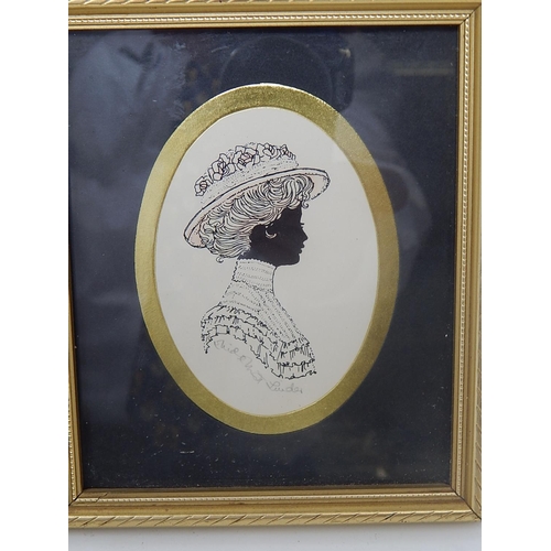 443 - A Pair of Framed Silhouettes of a Lady & Gentleman signed 