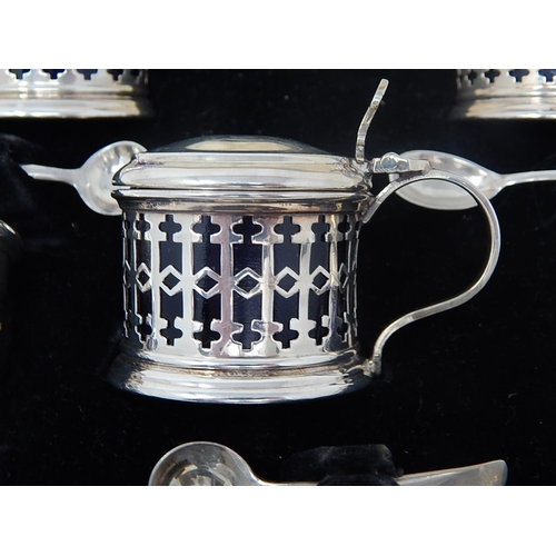 68 - Silver 5 Piece Cruet Set of Pierced Form with Blue Glass Liners. Hallmarked Birmingham 1932 within t... 