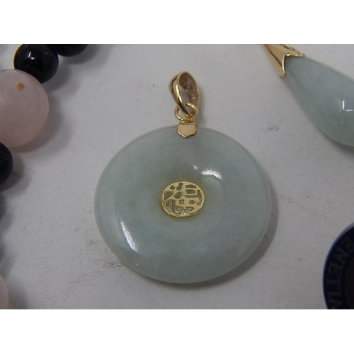 154 - Jade disc pendant with a 14ct bail, a single jade earring with a 14ct post, together with some silve... 