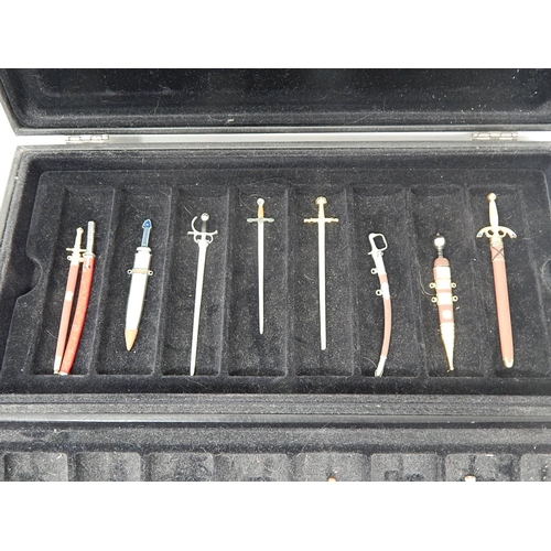 458 - Set of Fine Miniature Swords within their fitted Case: Together with paperwork.