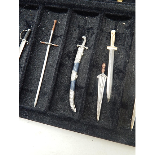 458 - Set of Fine Miniature Swords within their fitted Case: Together with paperwork.