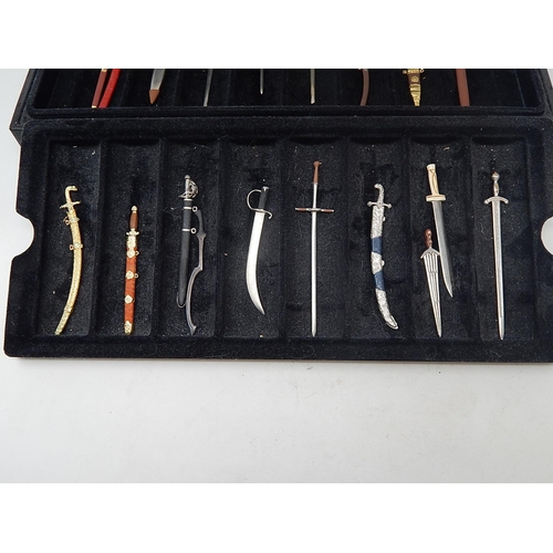 458 - Set of Fine Miniature Swords within their fitted Case: Together with paperwork.