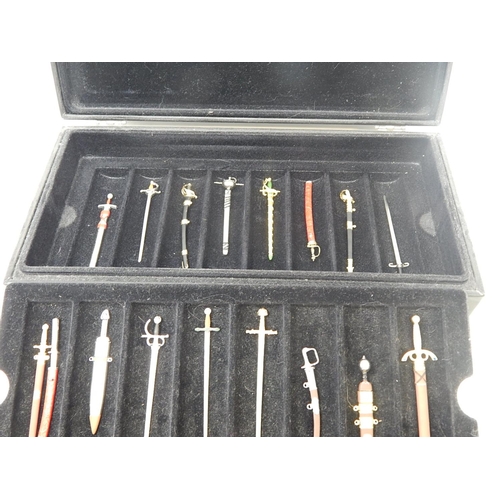 458 - Set of Fine Miniature Swords within their fitted Case: Together with paperwork.