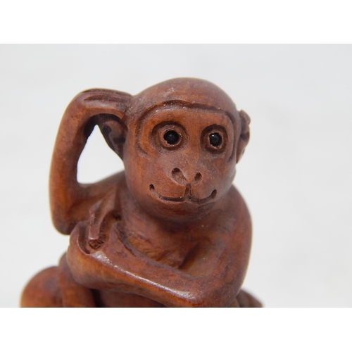 484 - CHINESE: Carved Wood Neksuke of a Monkey on a Barrel: Measures 5.2cm Wide