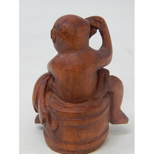 484 - CHINESE: Carved Wood Neksuke of a Monkey on a Barrel: Measures 5.2cm Wide