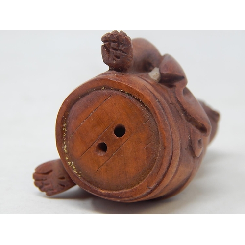 484 - CHINESE: Carved Wood Neksuke of a Monkey on a Barrel: Measures 5.2cm Wide