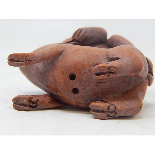 485 - CHINESE: Carved Wood Neksuke of a Monkey riding a Pig: Measures 5.4cm High