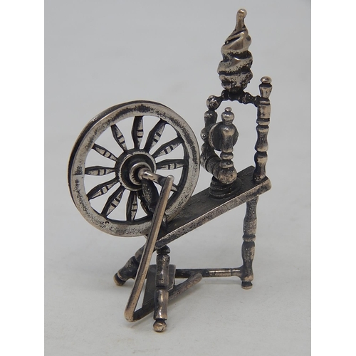 99H - Dutch Silver Model of a Spinning Wheel with articulated wheel: Measures 6cm high