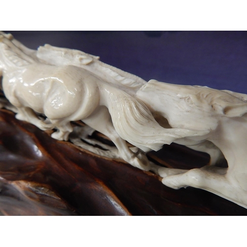 488 - Meiji Period (1868-1912) Japanese Ivory Tusk Carved as a Team of Running Horses, a Rider Upon One on... 