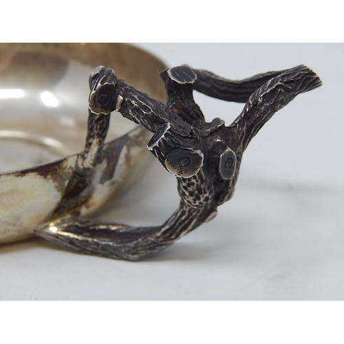 28 - ANTHONY ELSON: Silver Tastevin with naturalistic handle formed as branches complimenting a plain cir... 