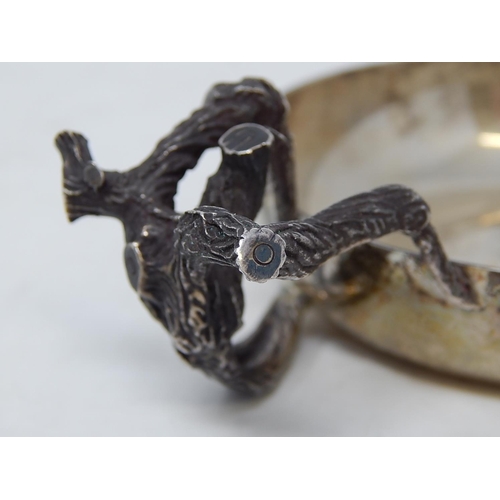 28 - ANTHONY ELSON: Silver Tastevin with naturalistic handle formed as branches complimenting a plain cir... 