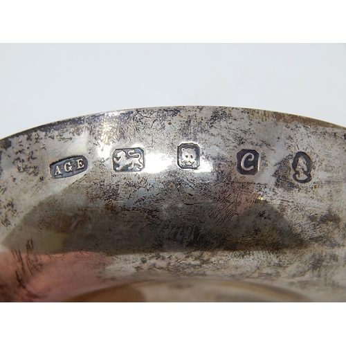 28 - ANTHONY ELSON: Silver Tastevin with naturalistic handle formed as branches complimenting a plain cir... 