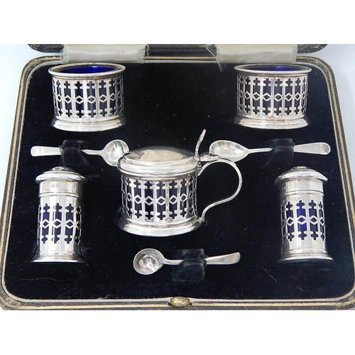 39 - Silver 5 Piece Cruet Set of Pierced Form with Blue Glass Liners. Hallmarked Birmingham 1932 by Barke... 