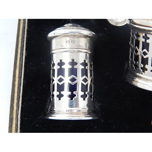 39 - Silver 5 Piece Cruet Set of Pierced Form with Blue Glass Liners. Hallmarked Birmingham 1932 by Barke... 
