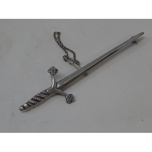 6 - Silver Kilt Pin Formed as a Scottish Sword. Bears strike marks & Initials:  Length 9cm