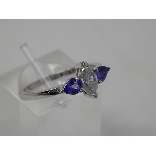 58 - Tanzanite and diamond three stone ring, central marquise cut diamond with a pear shaped tanzanite se... 