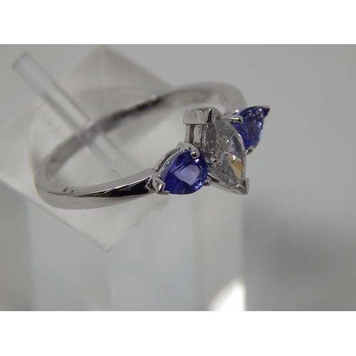 58 - Tanzanite and diamond three stone ring, central marquise cut diamond with a pear shaped tanzanite se... 