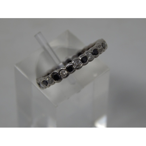 60 - Black and white diamond full eternity ring, alternating round cut black and white diamonds set in wh... 