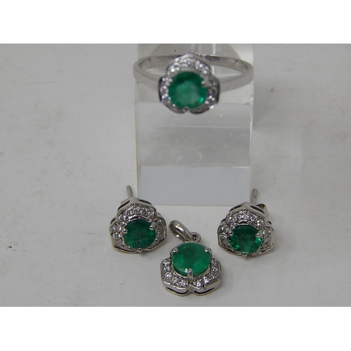 65 - Emerald and diamond pendant, ring and earring set, each item set with a round cut emerald and a surr... 