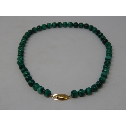 67 - Malachite Necklace with silver gilt clasp