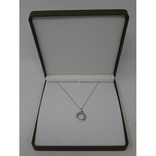 75 - 18ct White Gold Pendant inset with a circle of Baguette Cut Diamonds on an 18ct White Gold Chain. Bo... 