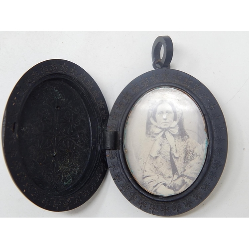 79 - Victorian Jet Mourning Locket Set with Central Raised panel carved with flowers & scroll banner insc... 