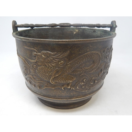 101 - Chinese Bronze Swing Handled Pot with Raised Dragon Decoration: Measures 18.5cm Diameter