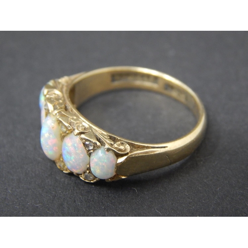 60 - Opal and diamond ring, five oval opals set with eight small rose cut diamonds in yellow metal stampe... 