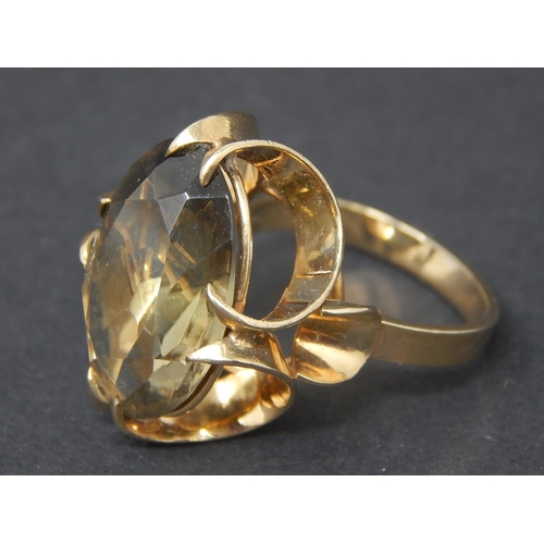 63 - Smoky quartz dress ring, oval cut smoky quartz mounted in a 9ct yellow gold fancy setting, ring size... 