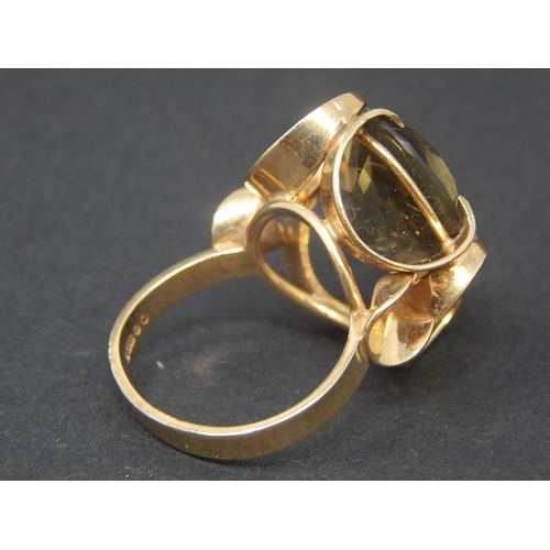 63 - Smoky quartz dress ring, oval cut smoky quartz mounted in a 9ct yellow gold fancy setting, ring size... 