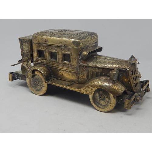 105 - Rare 1920's Indian Brass Desk Set & Cigarette Dispenser Formed as a Car: The Intricately Engraved Bo... 