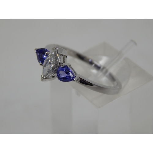 69 - Tanzanite and diamond three stone ring, central marquise cut diamond with a pear shaped tanzanite se... 