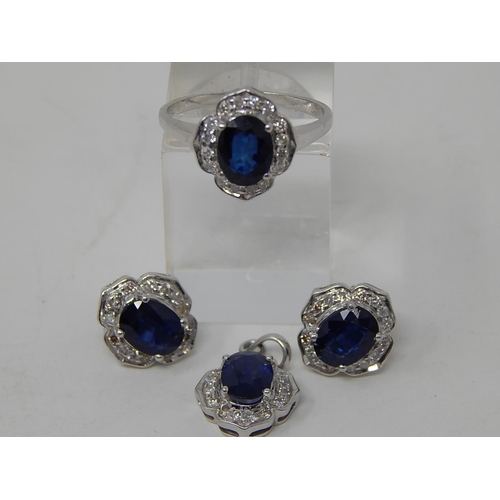 74 - Sapphire and diamond pendant, ring and earring set, each item set with an oval cut sapphire and a su... 