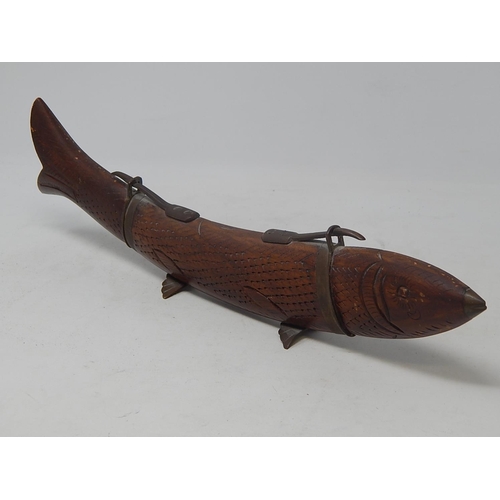 130 - Oriental canteen in the form of a fish. The tail as the fork & the head as the knife. 33cm long.