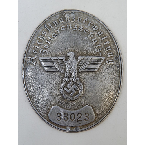 139 - WWII German Oval Shield with embossed party badge & stamped 33023. Measures 8cm x 6m5cm