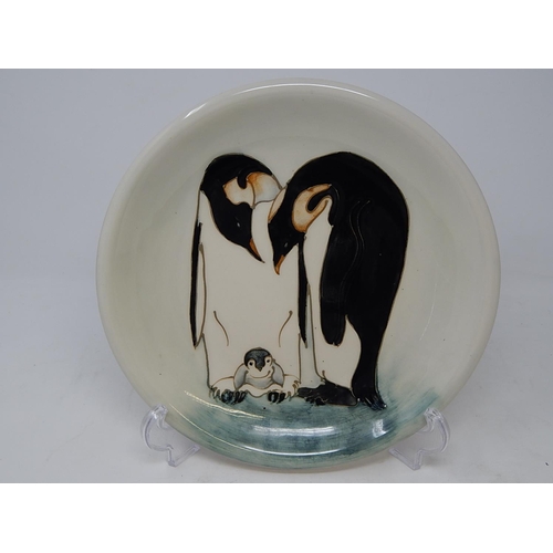 148 - A Moorcroft 'Penguin' plate, 25.7cm dia., impressed factory mark and date cypher, green painted mono... 