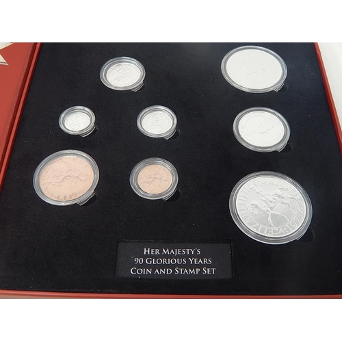 185 - HM 90 Glorious Years coin and stamp set